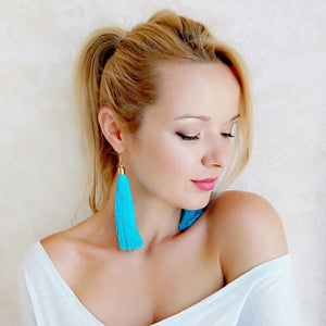 Girl Wearing Blue Tassel Earrings