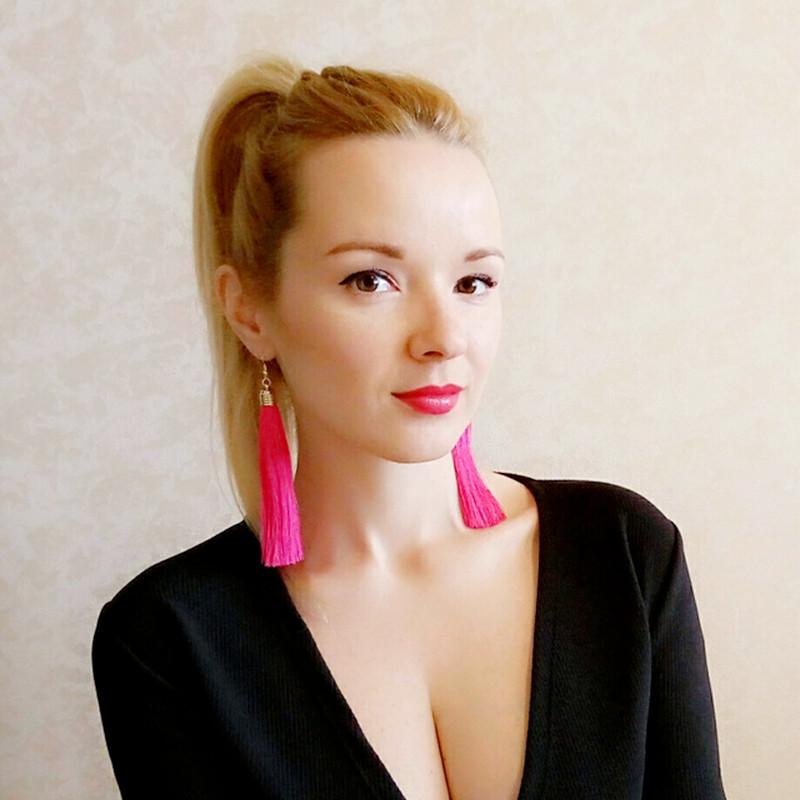 Girl Wearing Pink Tassel Earrings